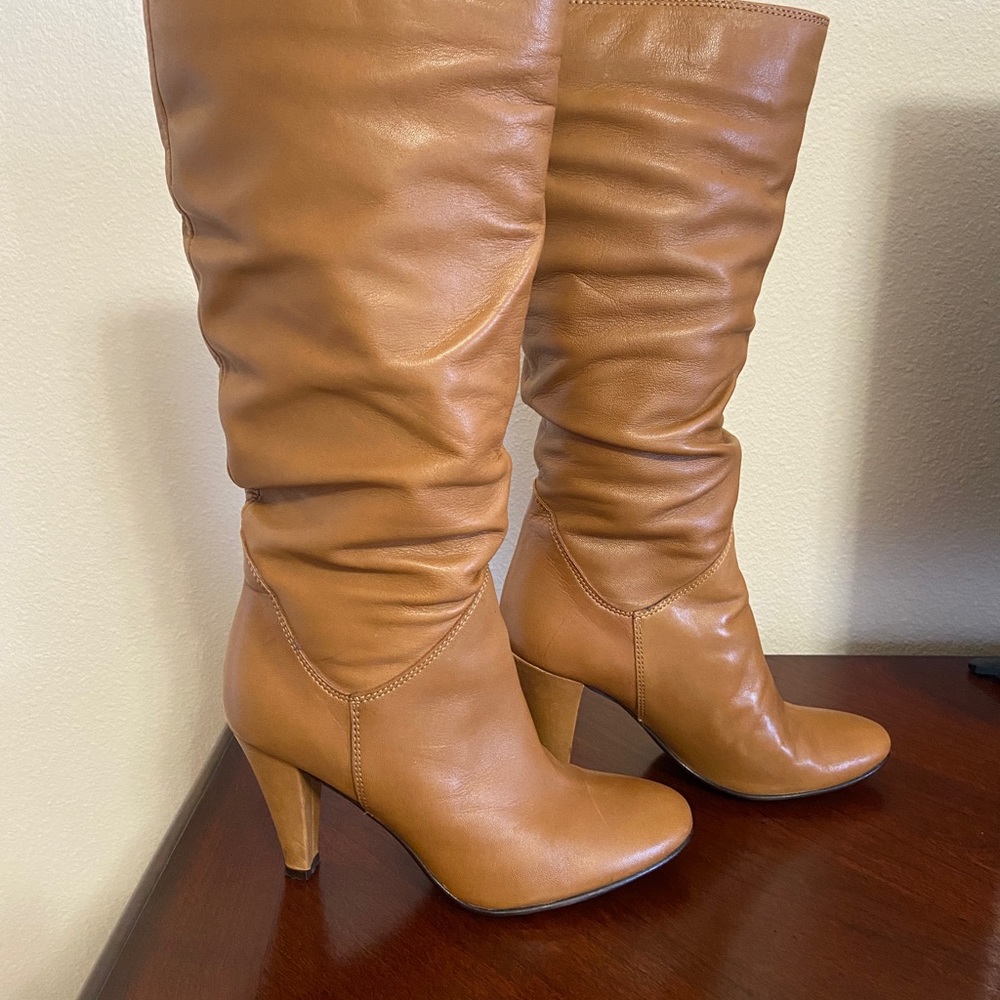 Tan tall Aldo boots size 6.